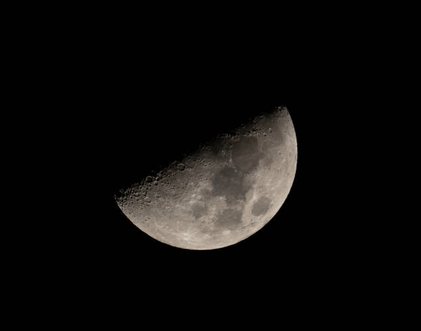 istock half waxing gibbous moon on night sky 1939117485