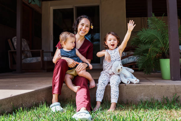 istock Happy little kids playing outside with their mom 1939138236