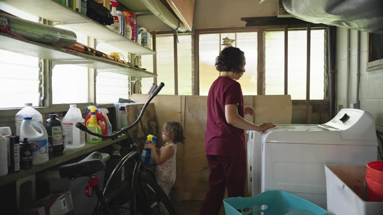 Nurse doing laundry at home after work