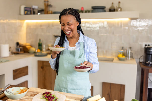 istock Happy woman in the kitchen 1939148429