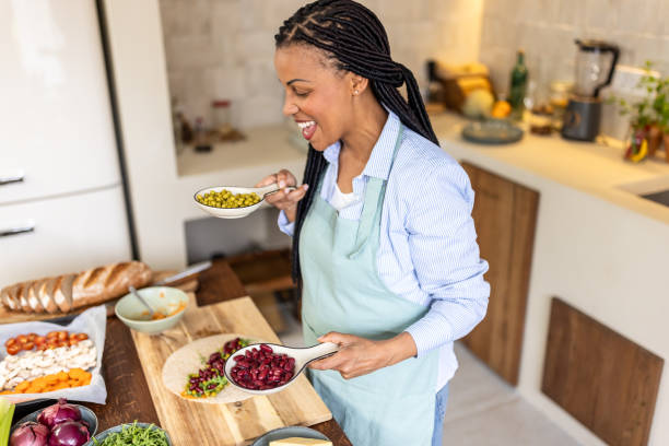 istock Happy woman in the kitchen 1939151078