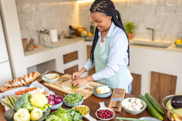 istock Afro-American woman is preparing tortillas 1939155228
