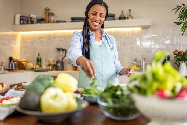 istock Happy woman in the kitchen 1939156275