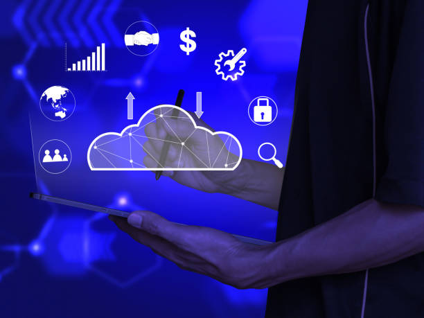 istock man holding tablet and pen. Blurred blue background 1939169919