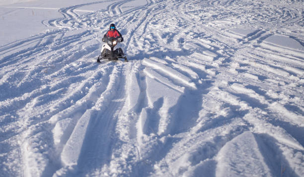 Wet tire tracks on a frozen lake, close up