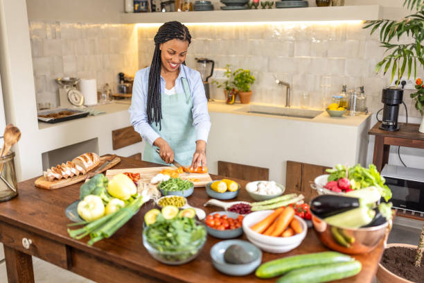 istock Woman making healthy vegetable salad meal 1939173077