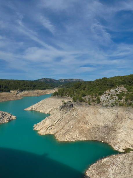 istock Magnificent provencal landscape in vertical format under a pretty blue sky with the Bimont lake and its turquoise blue water in Provence near Aix en Provence 1939175143