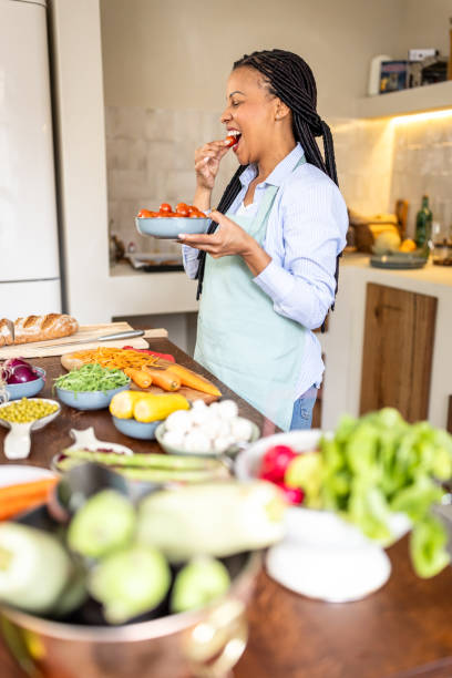 istock Woman making healthy meal in the kitchen 1939175664