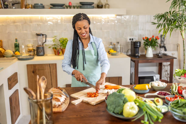 istock Woman making healthy vegetable salad meal 1939180853