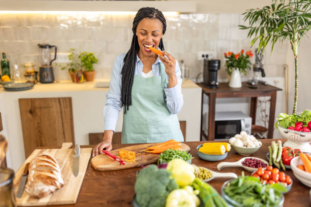 istock Woman making healthy meal in the kitchen 1939180861