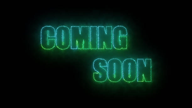 istock Neon sign with the words COMING SOON glowing in green on a dark background. 1939185516