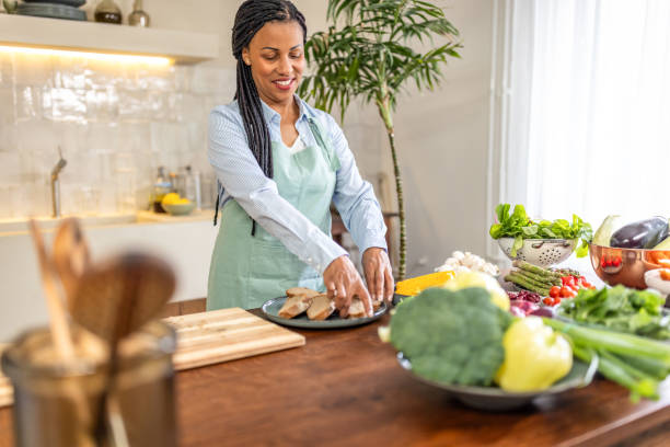 istock Woman making healthy meal in the kitchen 1939191934