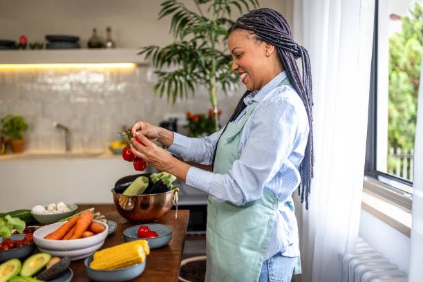 istock Woman making healthy meal in the kitchen 1939195049