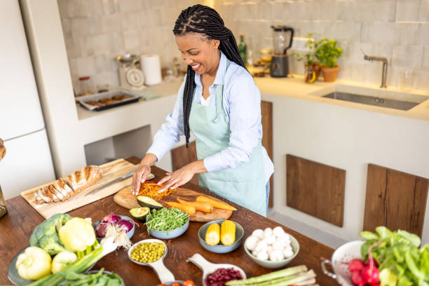 istock Woman making healthy vegetable salad meal 1939199797