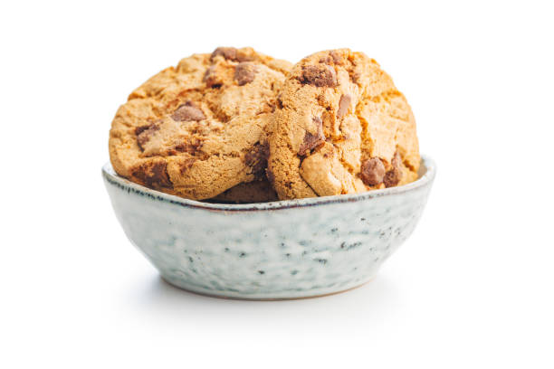 istock Sweet chocolate cookies in bowl isolated on white background. 1939200345