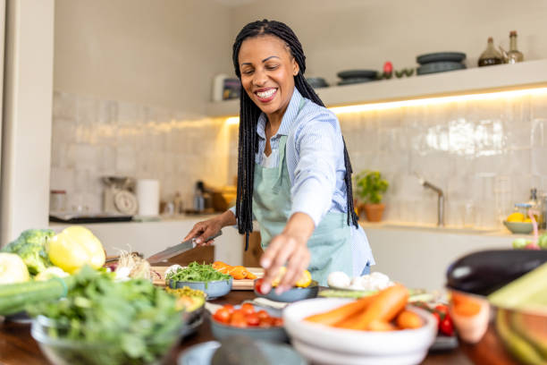 istock Woman making healthy vegetable salad meal 1939202455