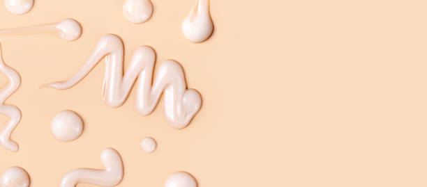 istock cosmetic smear texture on pastel beige background 1939255791