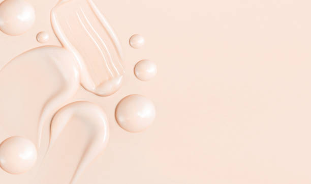 cosmetic smear texture on pastel beige background