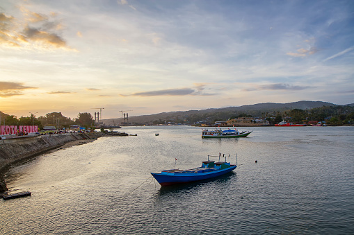 boats on the river at sunset. kendari city bay, southeast Sulawesi, Indonesia