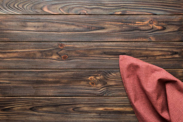 istock top view with red empty kitchen napkin isolated on table background. Folded cloth for mockup with copy space, Flat lay. Minimal style 1939288967