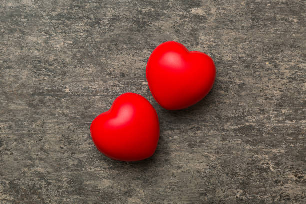 istock red heart shape on colored background. minimal concept top view with copy space 1939289519