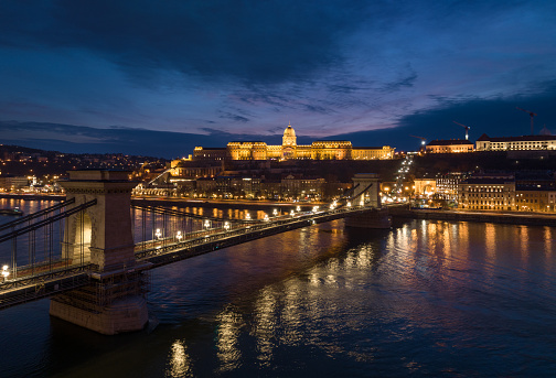 Night Buda Castle and Szechenyi Chain Bridge in Budapest, Hungary. Danube River