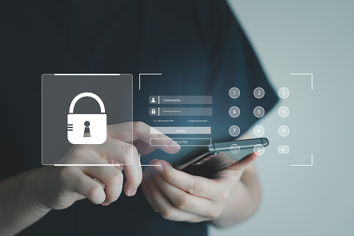 Hand using internet on mobile smartphone and screen show security for require to login with username and password or fingerprint scanning authentication. Cyber security and encryption concept.