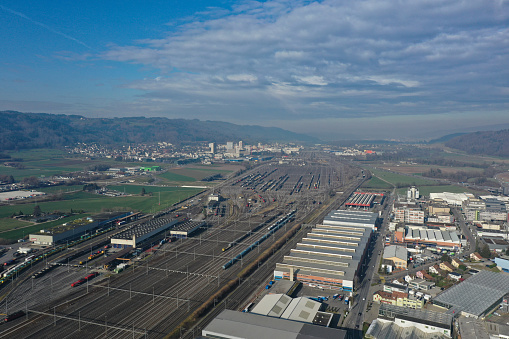 Dietikon is the fifth biggest city of the canton of Zürich. The image shows the Municipality partially with a huge trackfield, captured during autumn season.