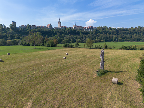 Bad Wimpfen with a view of the old church and the historic city wall over fields, drone shoot