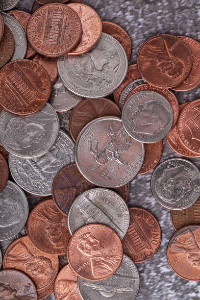 istock American coins and US dollars on a wooden table 1939407831