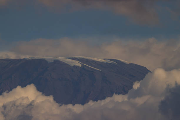 partly cloud-covered peak of mount kilimanjaro