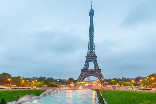 Eiffel tower at sunrise viewed from Jardins du Trocadero in Paris, France. Famous landmark and popular travel destination.