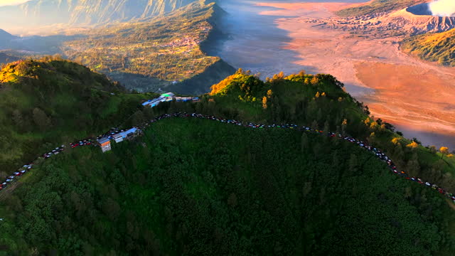 Aerial Drone moving over a Sunrise View Point, Penanjakan at Mount Bromo, Tengger Caldera, East Java, Indonesia