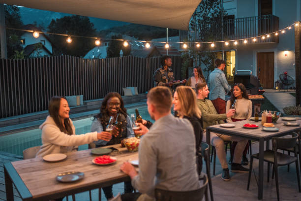 istock Multicultural Friends Gathering for Outdoor Party at Dusk 1939448024