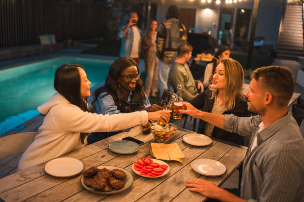 istock Multicultural Friends Enjoying Outdoor Dinner Party 1939457195