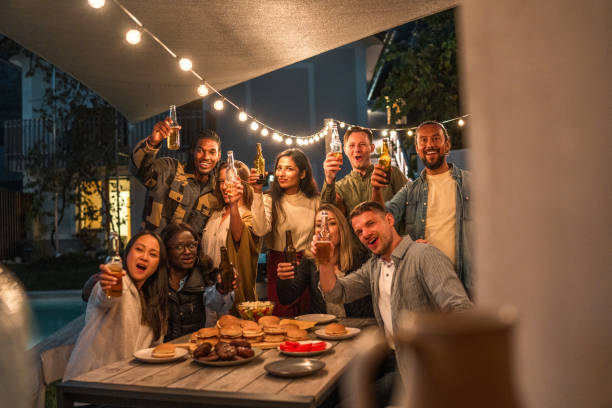 istock Diverse Group Enjoying Outdoor Party at Night 1939459305