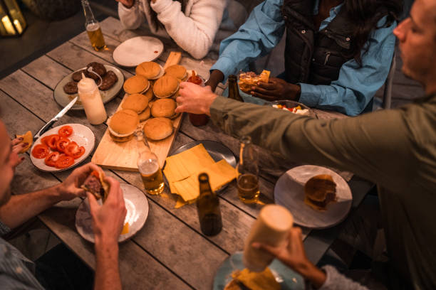 istock Diverse Group Enjoying Outdoor Party with Food and Drinks 1939463532