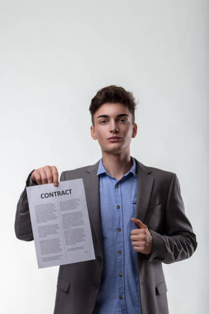 istock Contract affirmed, young professional's thumb signals satisfacti 1939468345