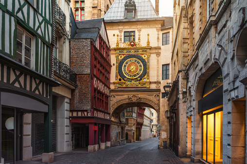 Medieval cozy street in Rouen with famos Great clocks or Gros Horloge of Rouen, Normandy, France with nobody. Architecture and landmarks of Normandie.