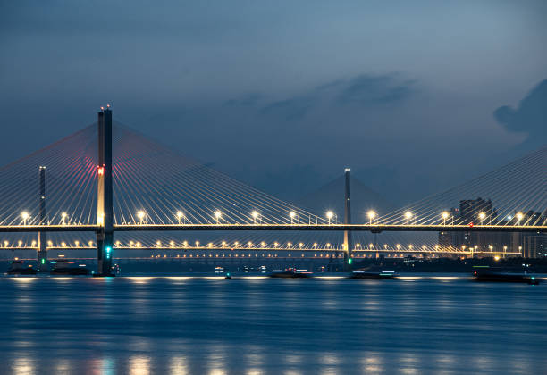 istock Illuminated Wuhan Yangtze River Second Bridge at dawn. 1939492906