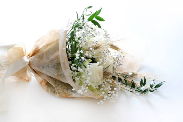 istock White roses and babies breath bouquet. 1939500331
