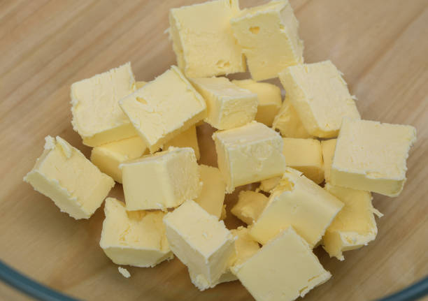 istock Yellow butter cut into cubes in a bowl close-up 1939501614