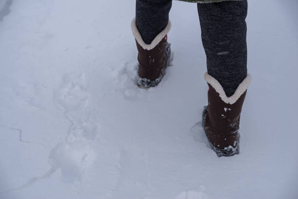 istock person walking in the snow 1939502337