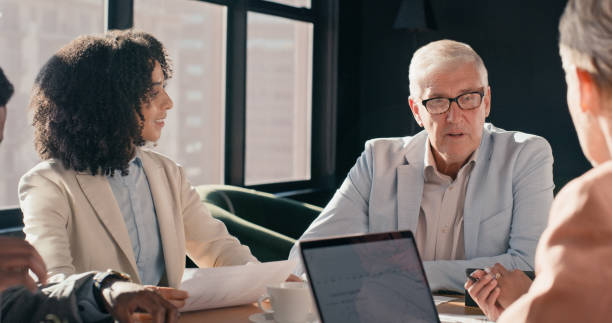 istock CEO, business people and meeting with team, discussion or feedback with project proposal or review in conference room. Corporate group, collaboration and communication, laptop for research with trust 1939505563