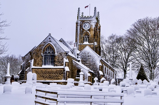 Haworth church and churchyard with headstones, this is beside the Bronte Parsonage and is the church where Emily and Charlotte Bronte's father was parson.