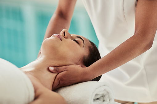 Relax, neck massage and woman at spa for health, wellness and luxury beauty treatment for calm. Peace, zen and young female person with natural body care therapy routine for rest at cosmetic salon.