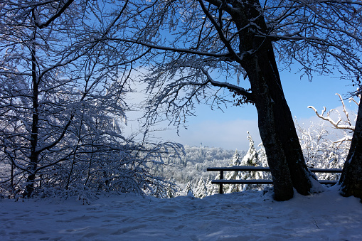 View of a Bavarian winter landscape with lots of snow, blue sky with clouds on a cold winter day, outdoor germany