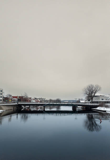 This is a photograph of historic Lullwater bridge crossing the lake in Prospect Park Brooklyn, NYC on a winter day.