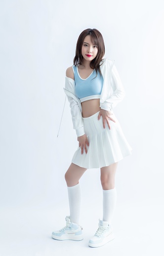 Cheerleader with blue and white outfit posing