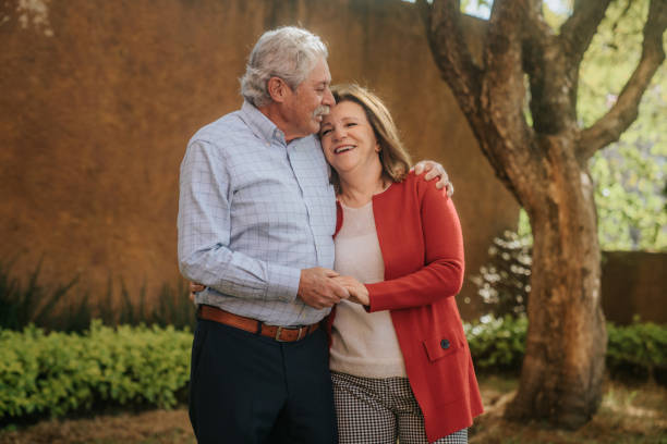 istock Senior couple hugging in garden 1939567174